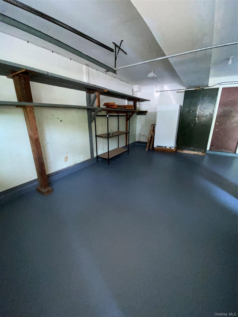 Spacious wide open private flat backyard with wooden swing and room for a pool or possibly even a pickleball court