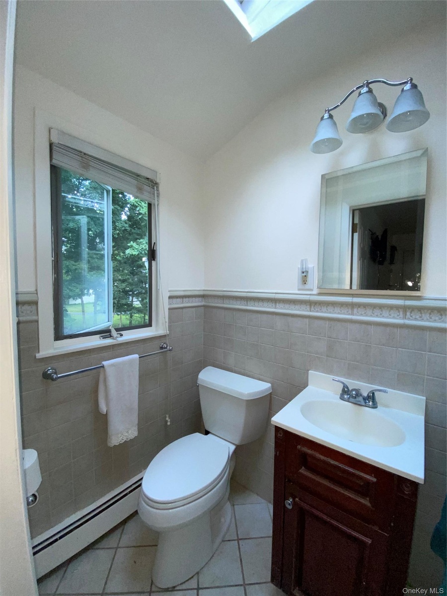 Bathroom #2 with skylight in primary bedroom suite