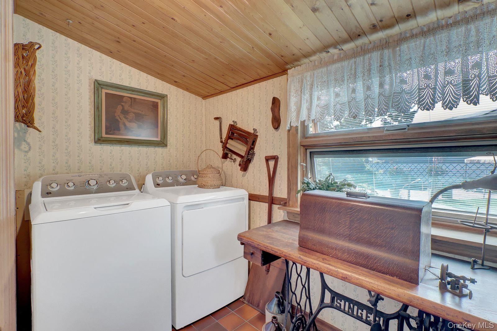 7'7 x 8'7   Laundry room conveniently located off the kitchen -Washer / Dryer