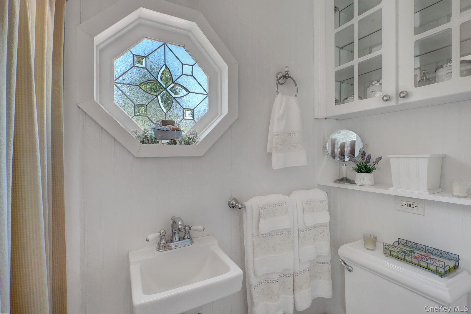 Full Bathroom located adjacent to the laundry room. For added convenience