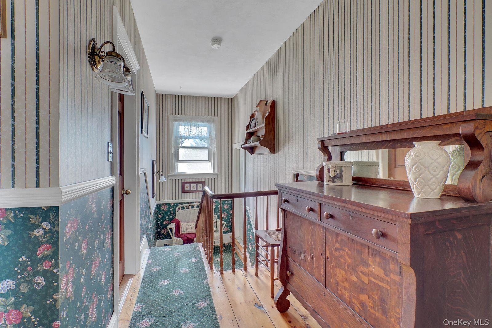 UPPER HALLWAY LEADS TO BEDROOMS AND BATHS