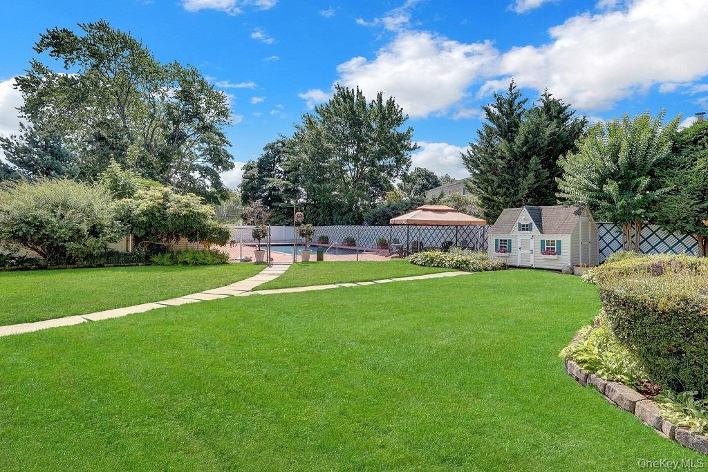 Back Yard offers a private retreat surrounded by lush, professionally landscaped grounds