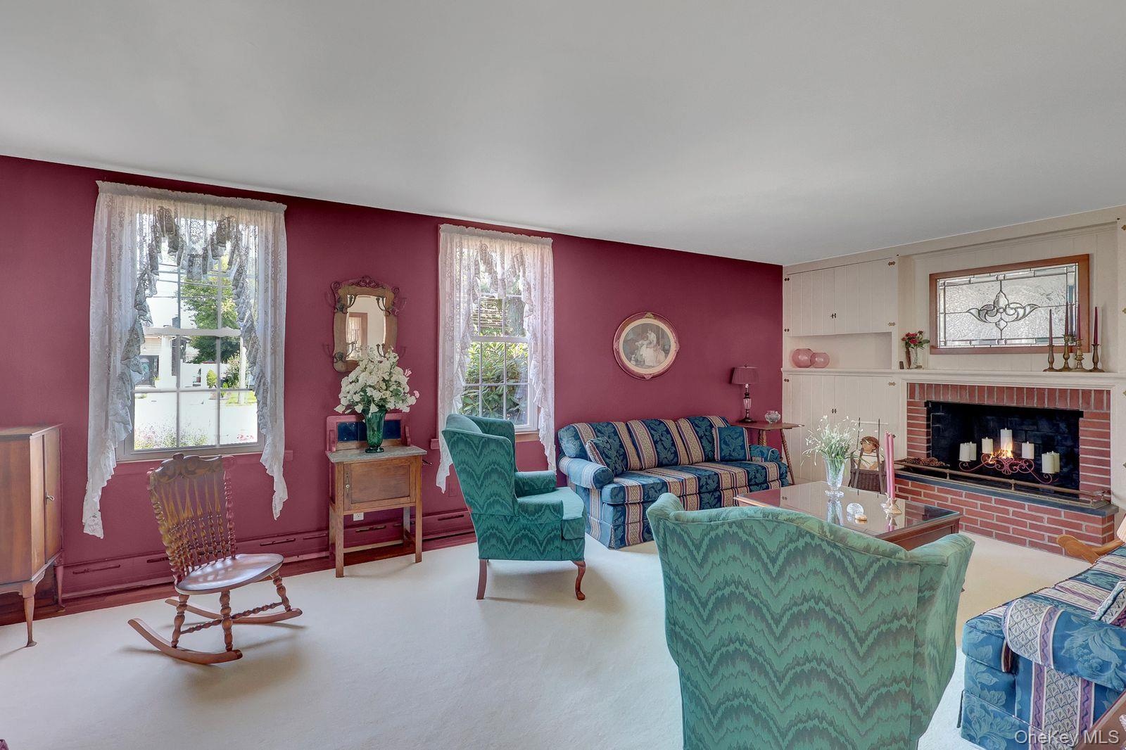 13' x 23'  Spacious Living room w soaring 9ft ceiling, Hardwood floors, and wood-burning FPL "Gas Available"