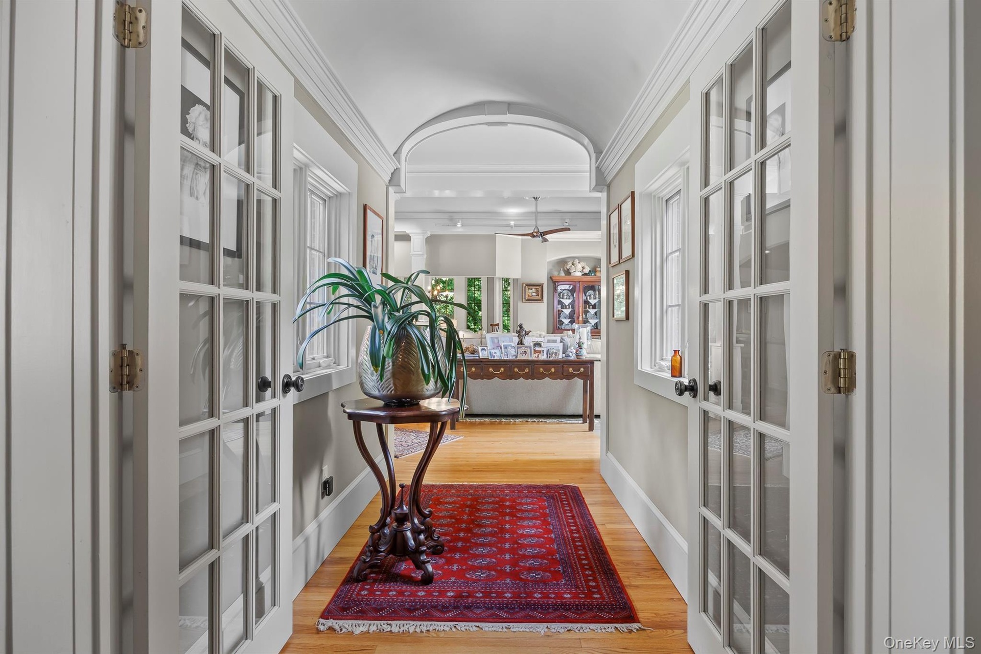 An elegant hallway leads from the foyer into the newer addition