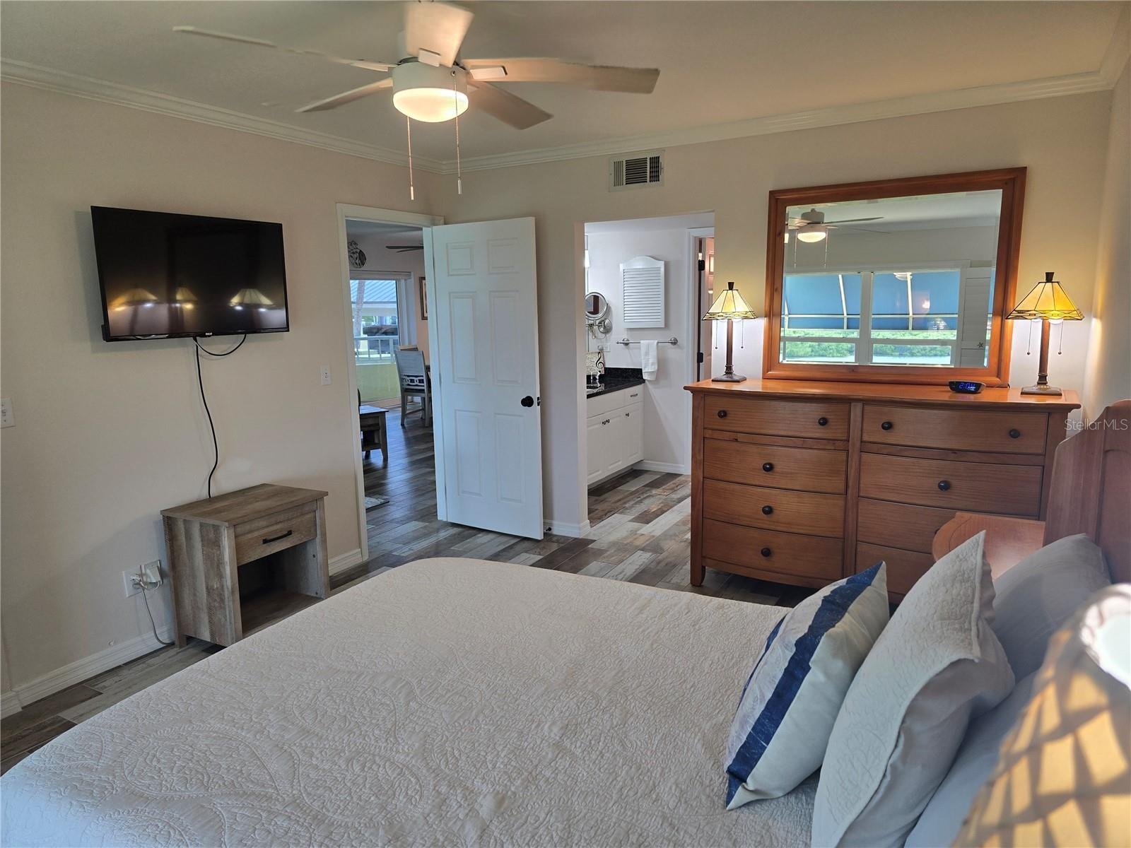 Primary bedroom with TV.