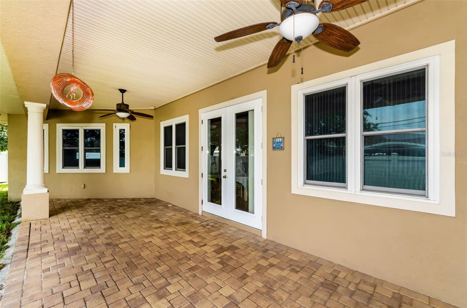 Can you imagine entertaining during the holidays on this beautiful covered paver back porch?