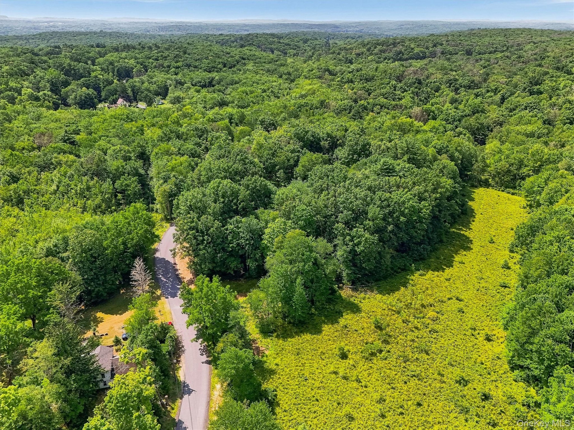 The property is on both sides of the road