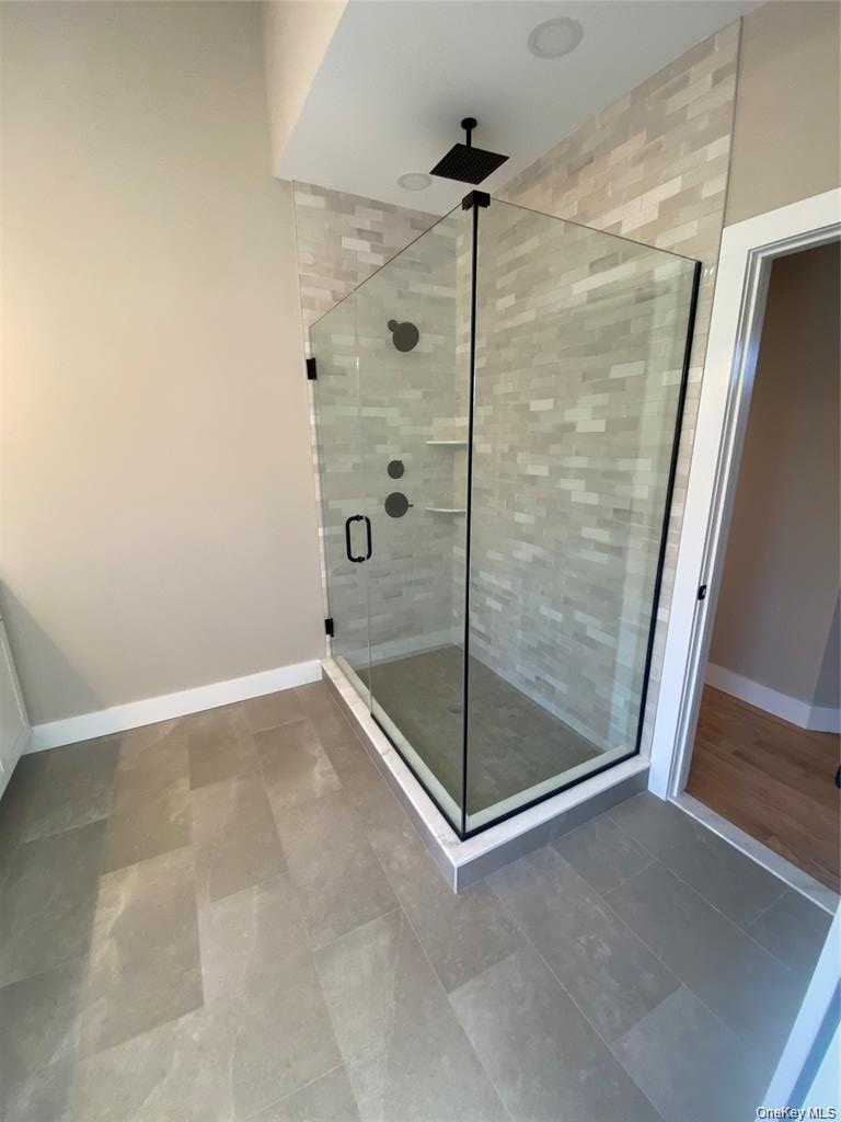 The walk-in shower offers a clean, modern, design for a comfortable daily routine.