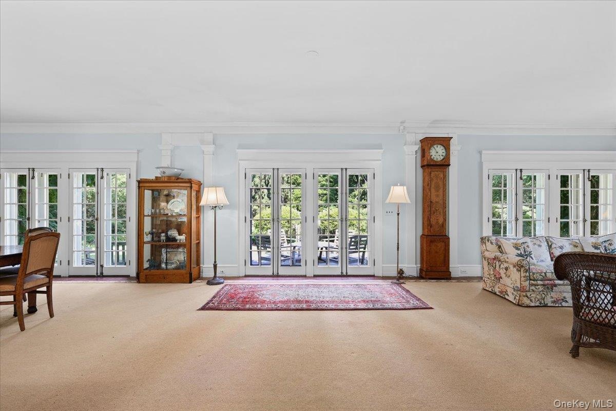 Stunning sun room that spans the width of the house, creates excellent flow