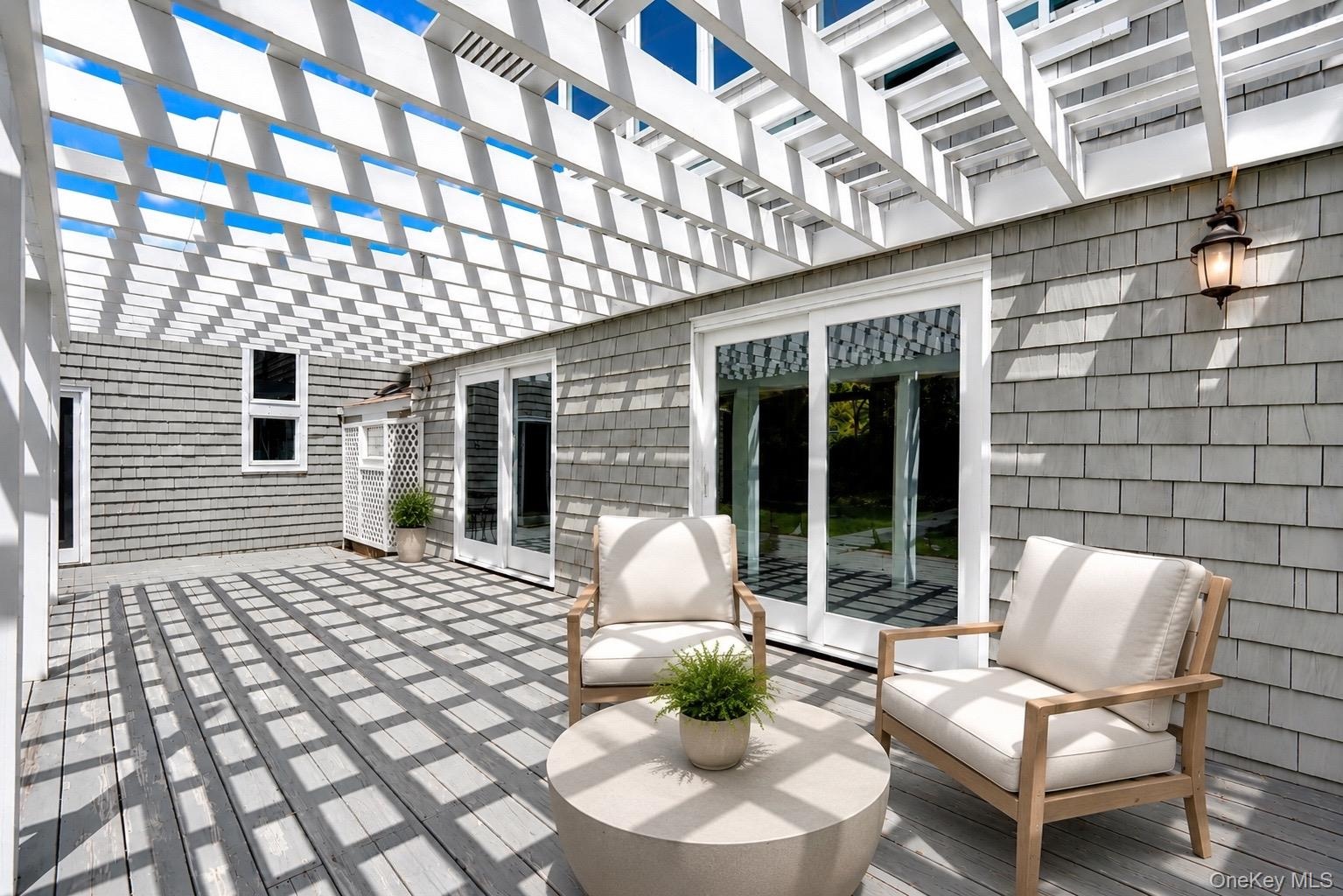 Patio overlooking the pool (Virtually Staged)
