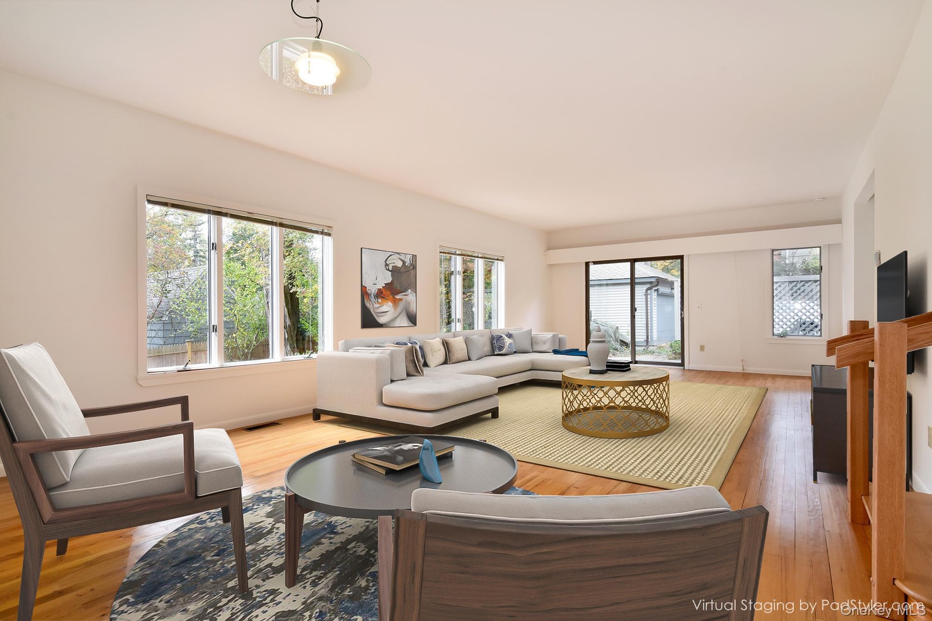 Virtually staged 30' Great Room featuring windows facing 3 directions