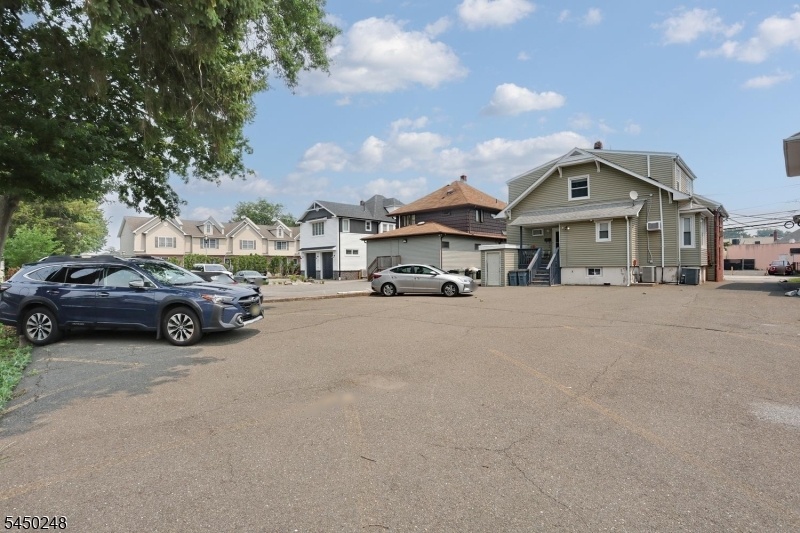 PRIVATE PARKING LOT IN REAR