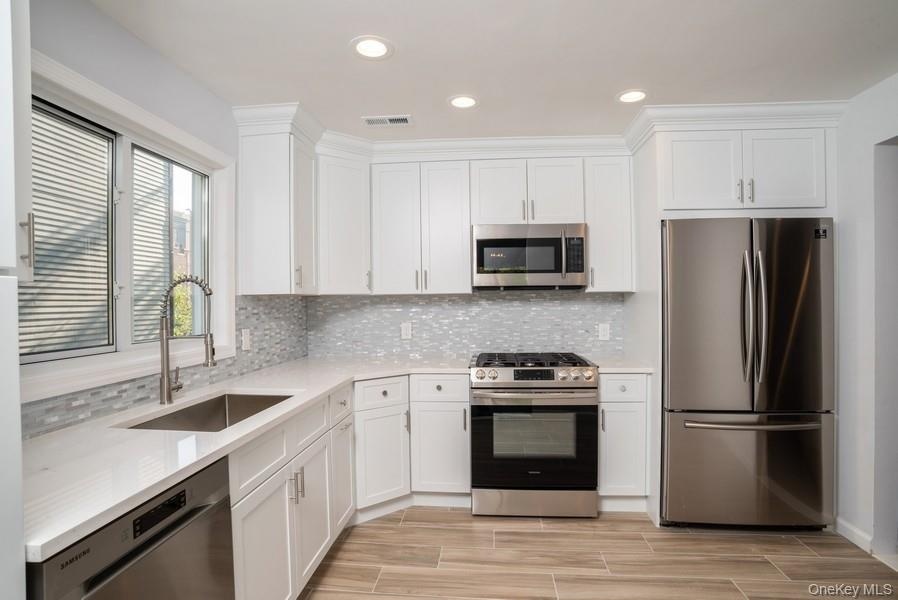Beautiful kitchen with Samsung Stainless steel Appliances