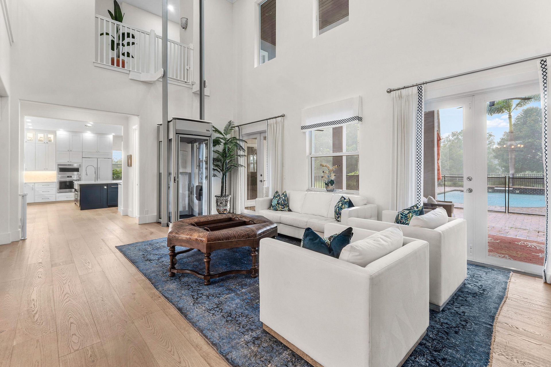 Living Room with pool views and removable elevator