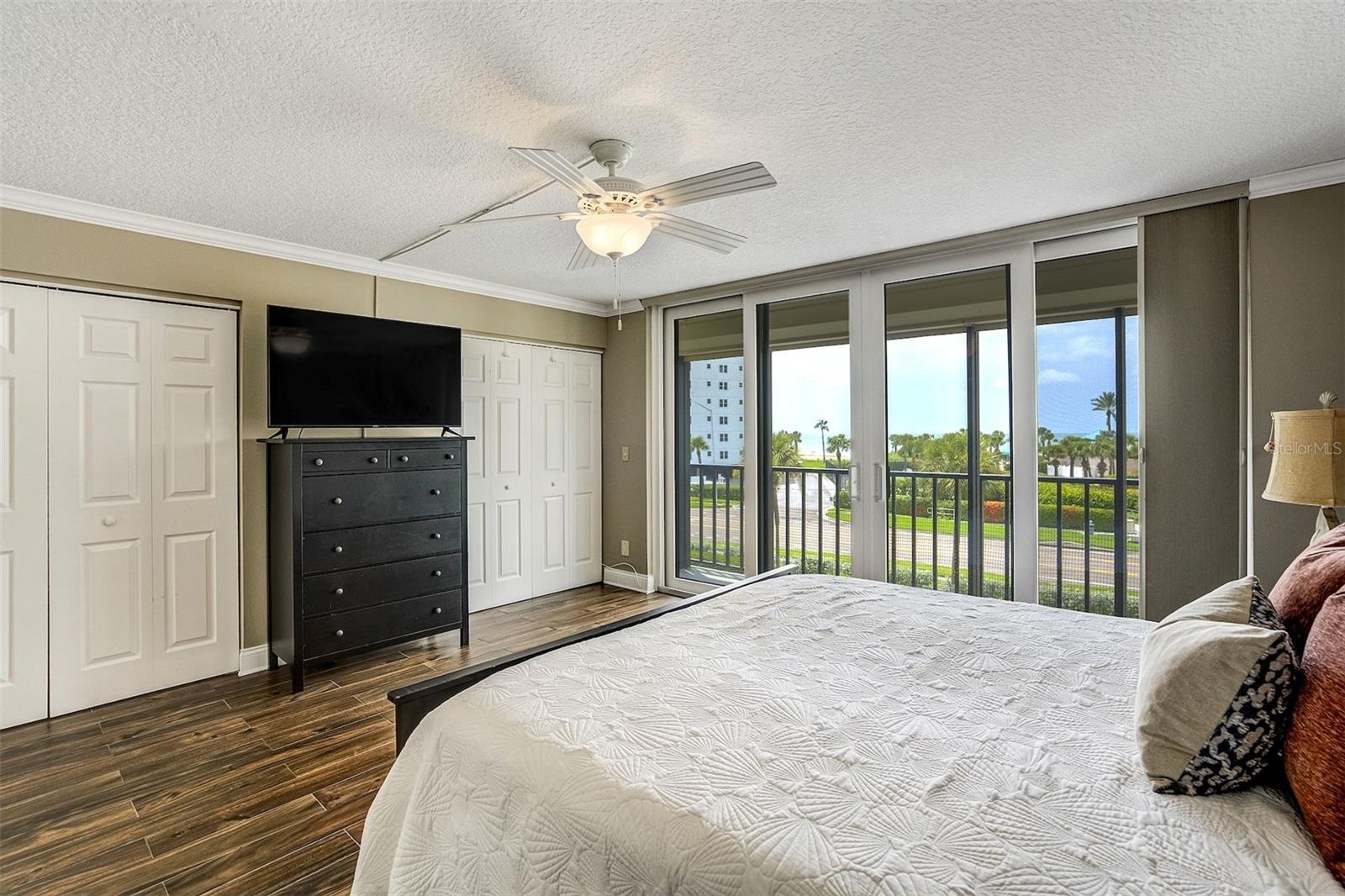 Primary Bedroom With Sliders To Outdoor Balcony