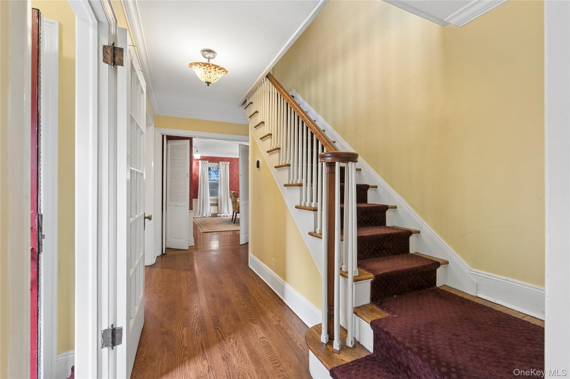Front hall with classic staircase