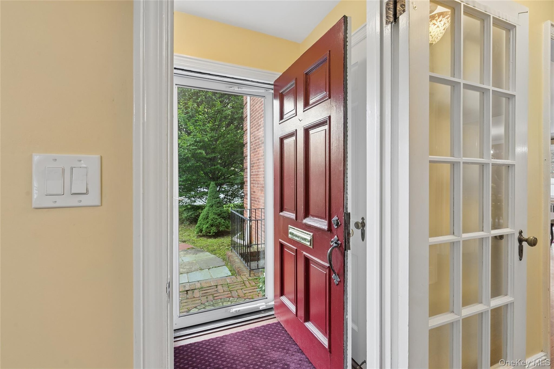 Gracious and welcoming foyer with guest closet