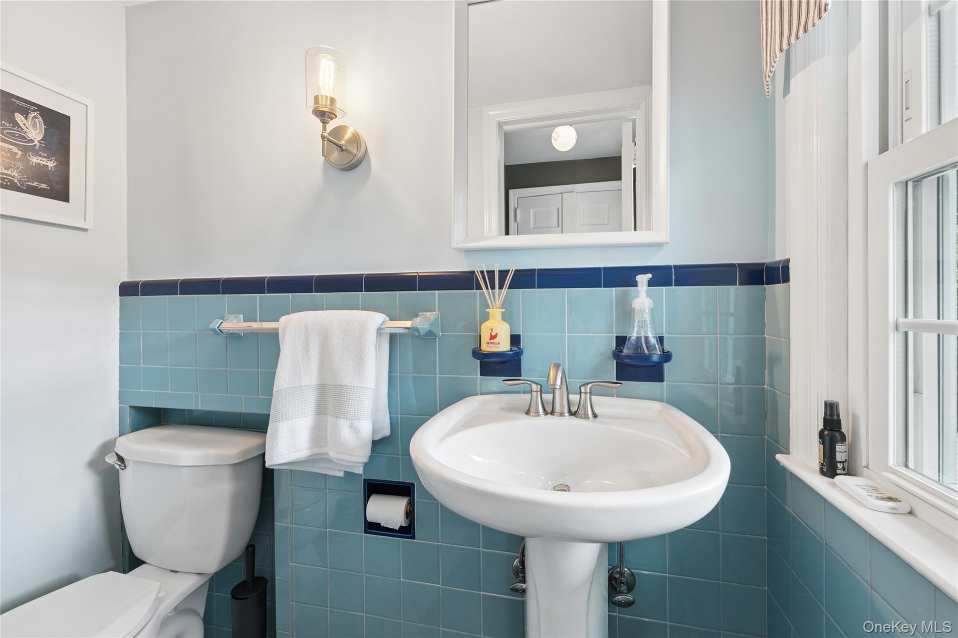 Perfectly located Half bath off the kitchen and back door to the patio