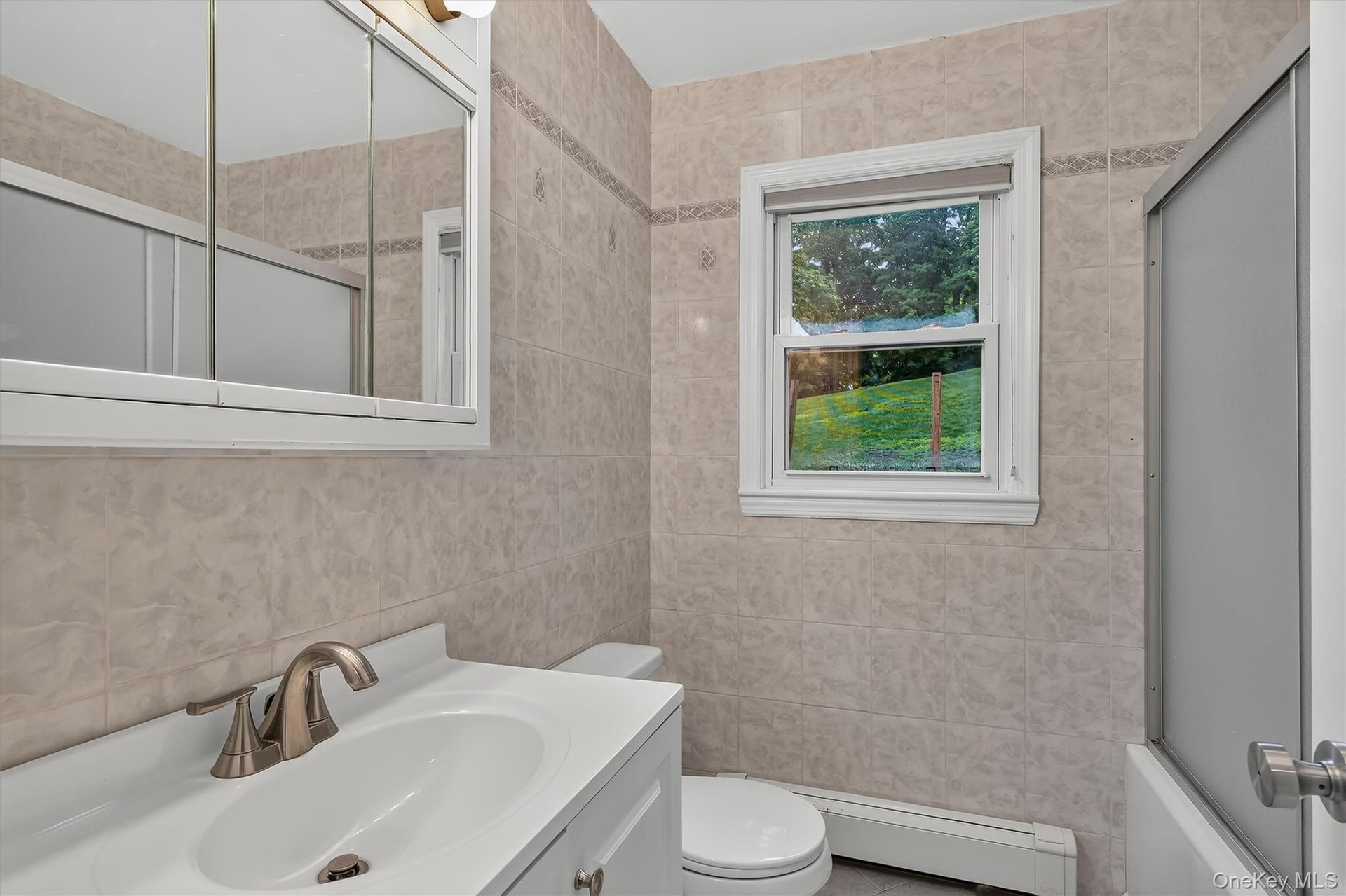 Conveniently located main-level full bathroom serves the three bedrooms and main living area.
