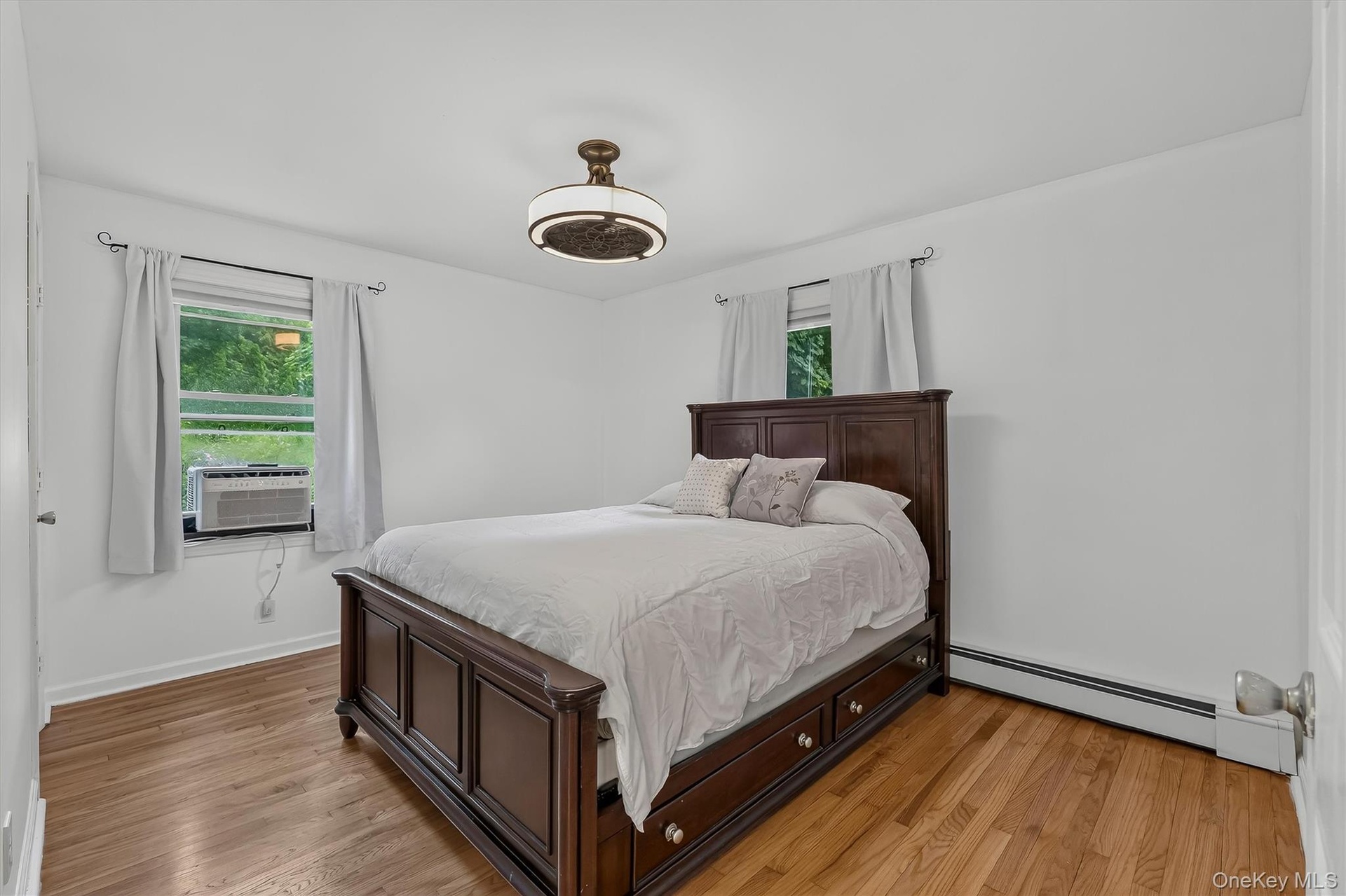 Spacious primary bedroom offers a comfortable and inviting retreat with plenty of natural light.