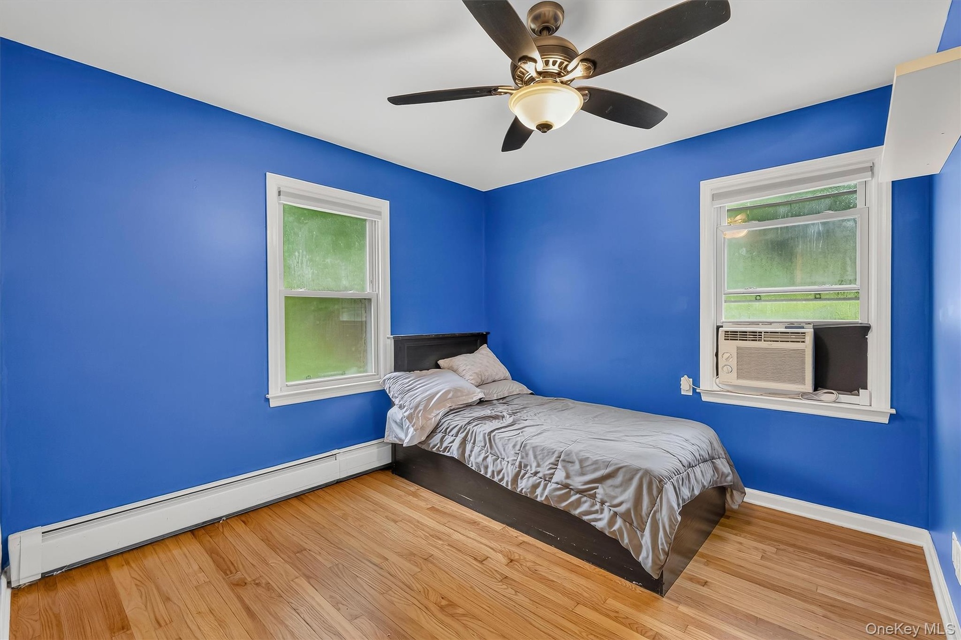 Versatile third bedroom with comfortable living space.