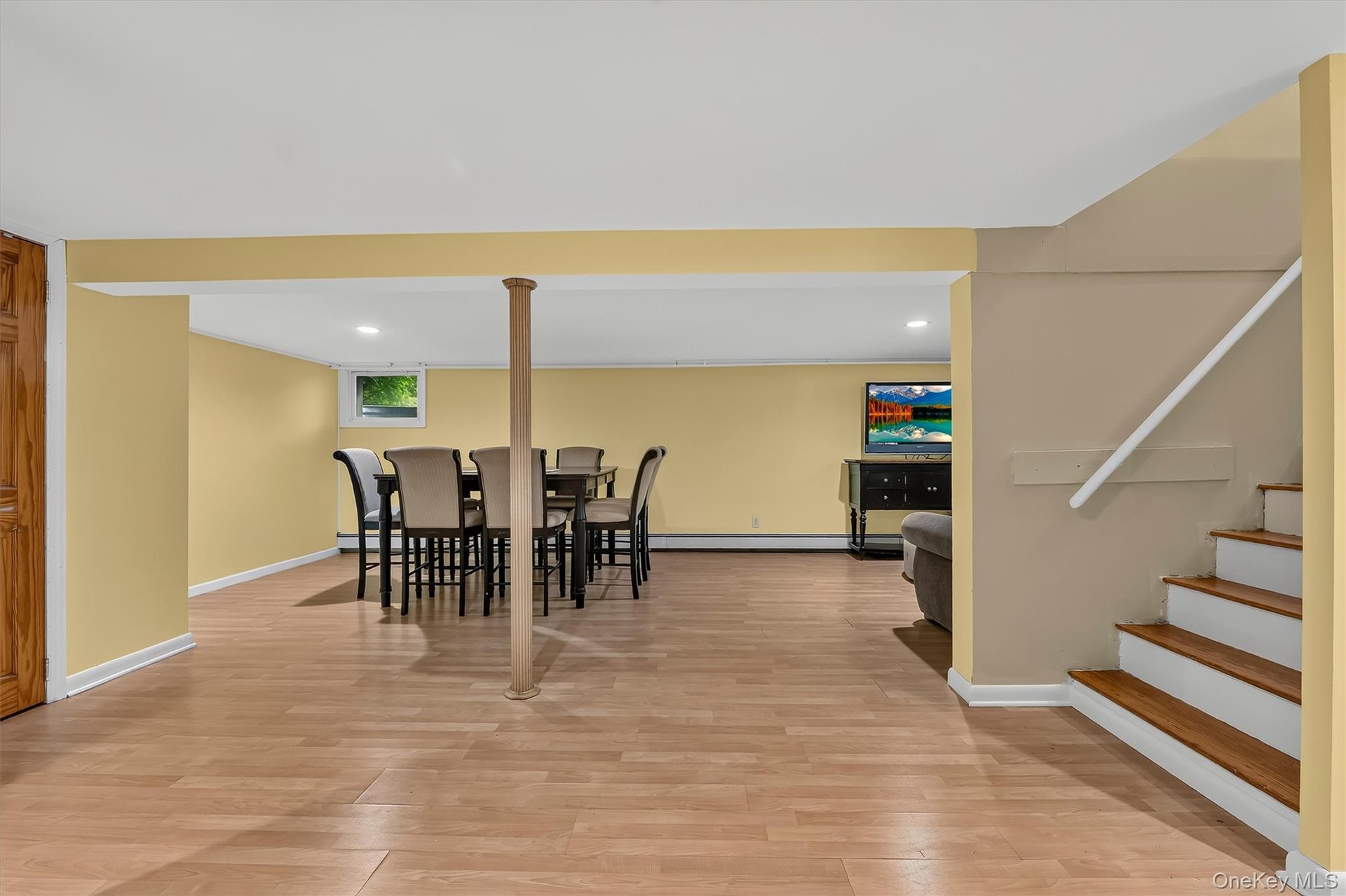 Spacious lower-level family room provides additional space to relax, gather, and entertain