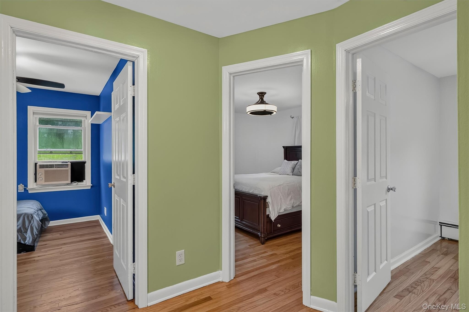 Main-level hallway provides easy access to all three bedrooms and the full bathroom.