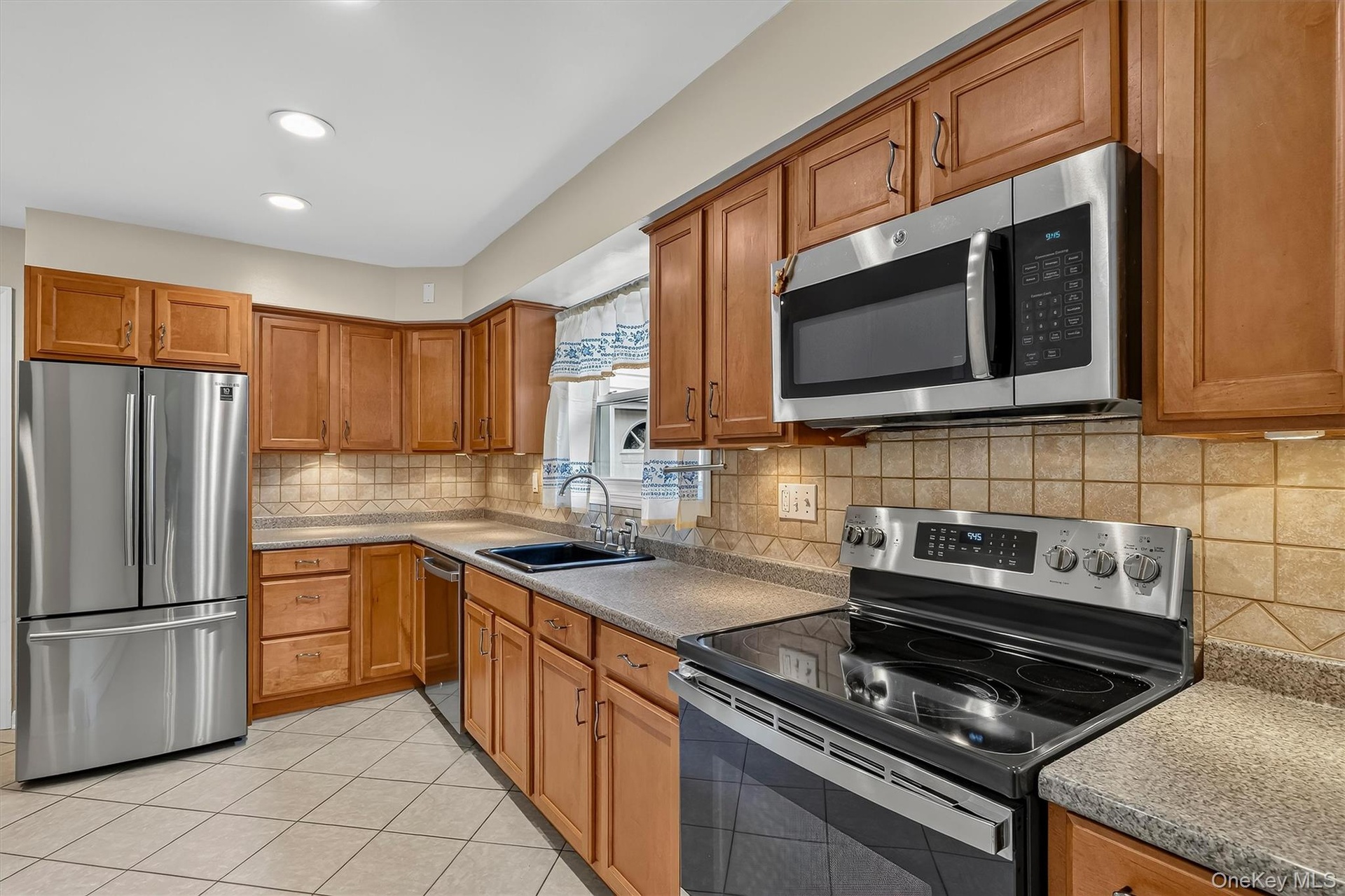 Well-appointed kitchen offers ample workspace and a comfortable layout for everyday cooking and entertaining.