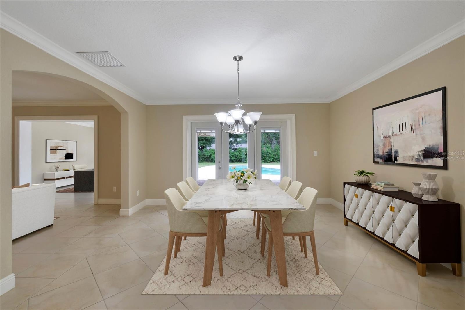 GRACEFUL ARCHED OPENINGS lead to the formal Dining Room, where French doors invite you outside to your PRIVATE BACKYARD RETREAT. Virtually Staged