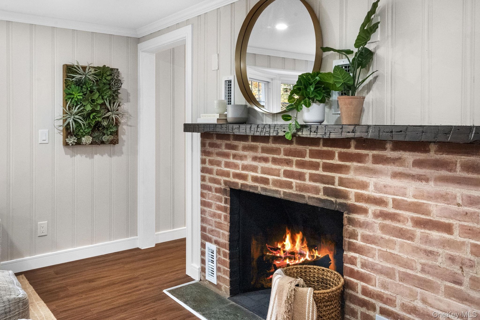 Modern charm meets rustic texture in this cozy focal point, perfect for curling up on cool evenings.