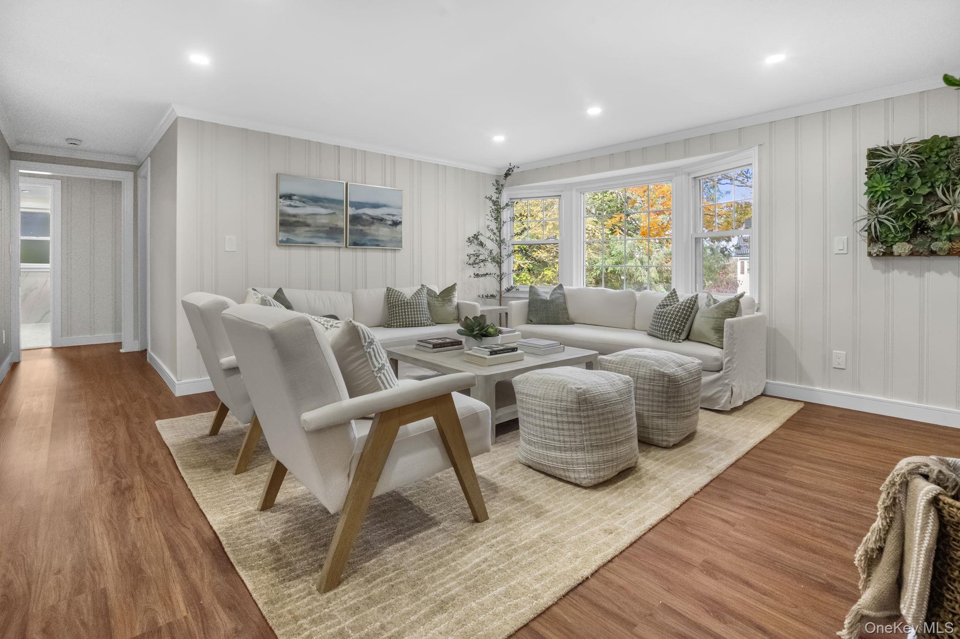 Open and welcoming living area with refinished floors and a seamless flow that’s perfect for gatherings or quiet evenings at home.