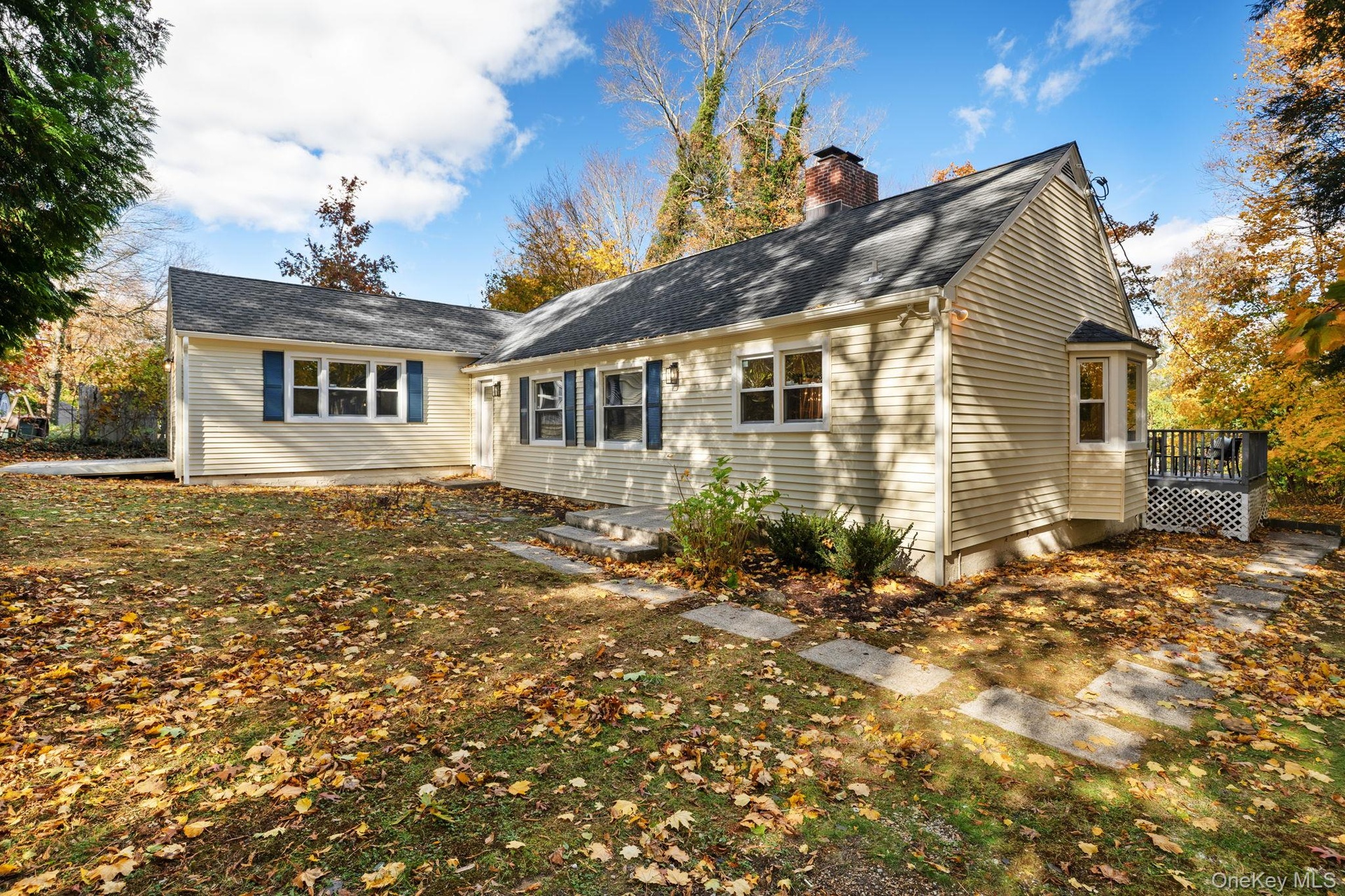 The freshly updated exterior and spacious side yard provide easy access around the home and plenty of space for outdoor enjoyment.