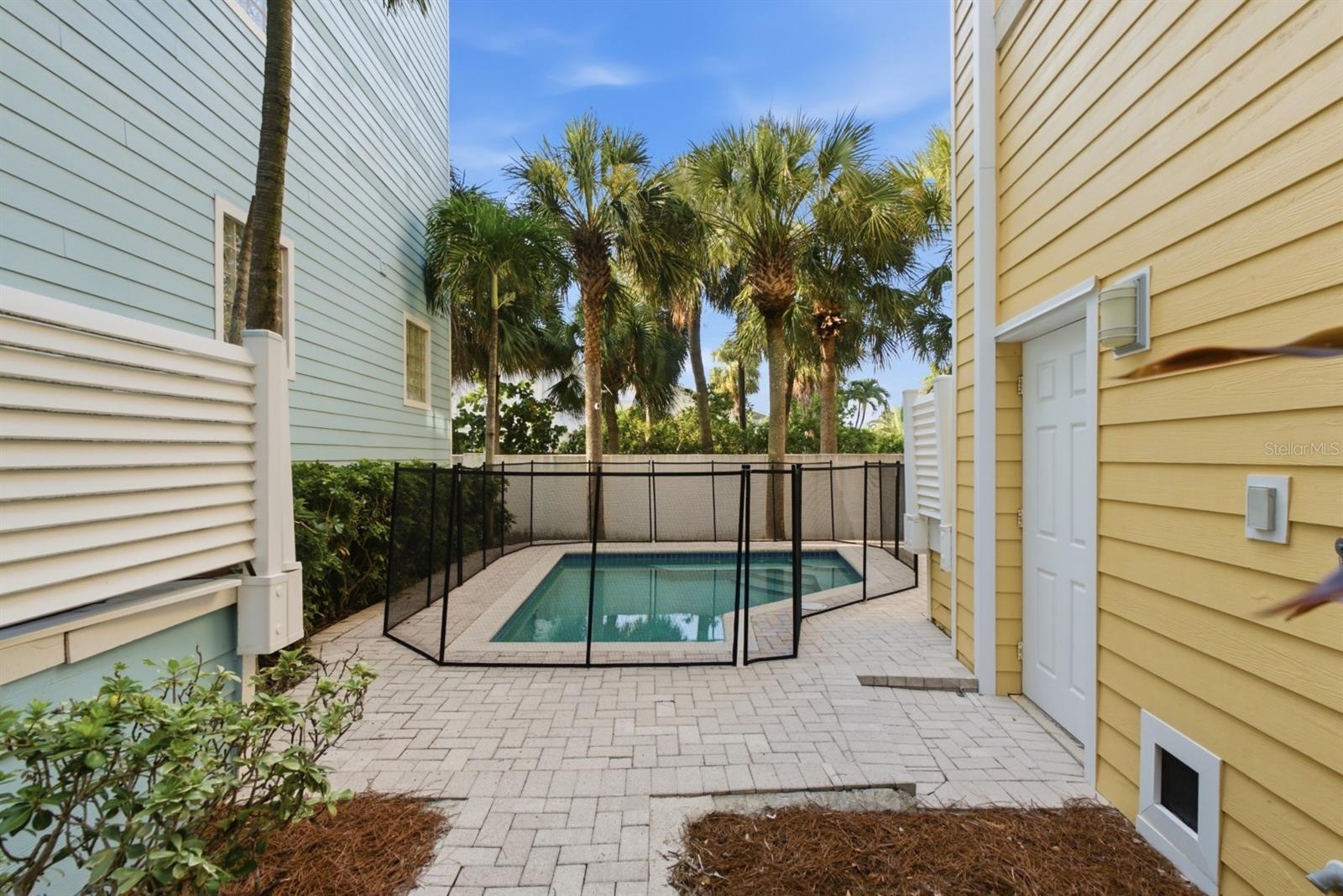 Private, heated salt water pool just steps to the beach