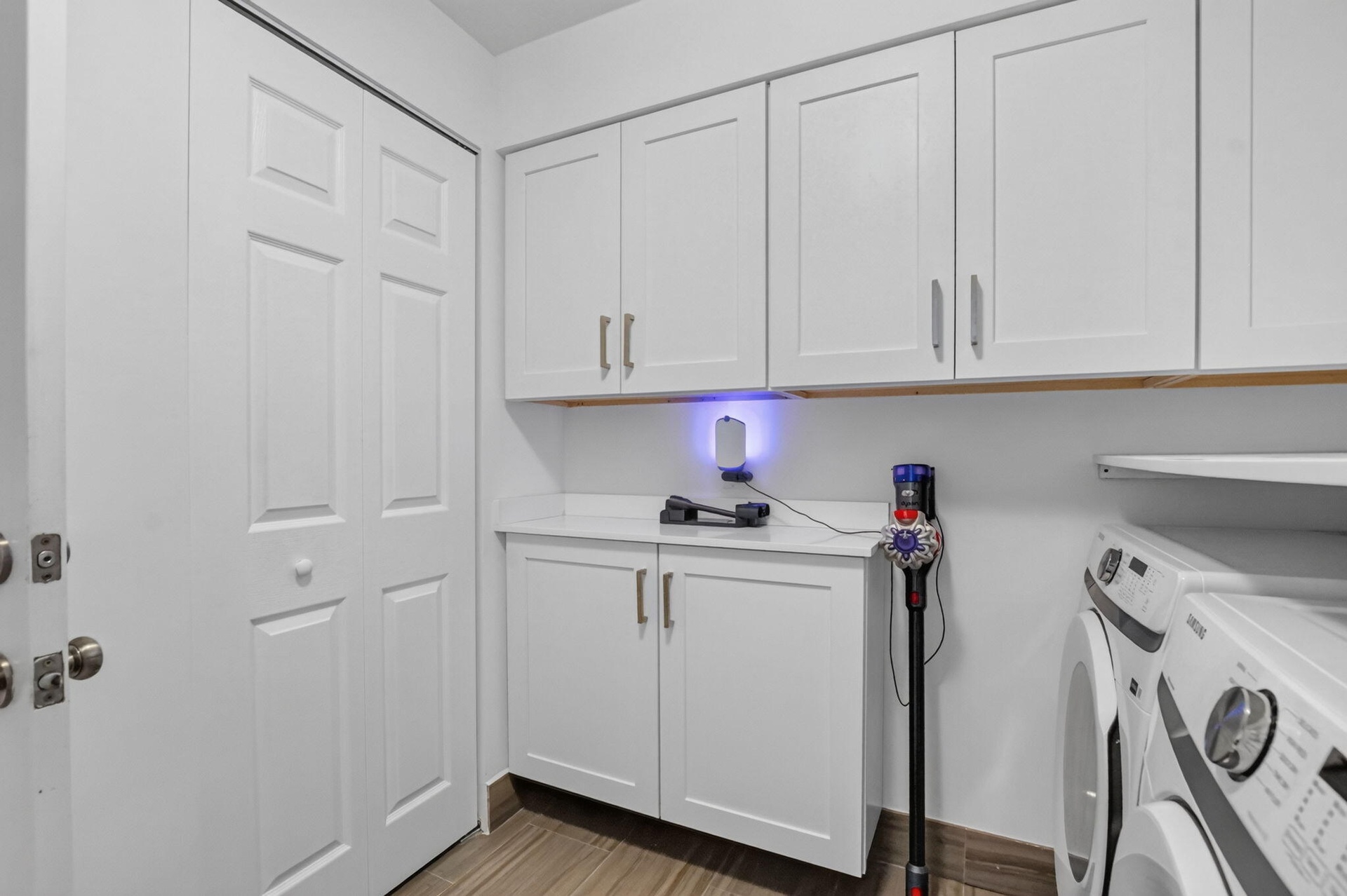 Current owner recently renovated this bright laundry room space. New Washer & Dryer installed, lots of new cabinets, a broom/ironing board closet, a n