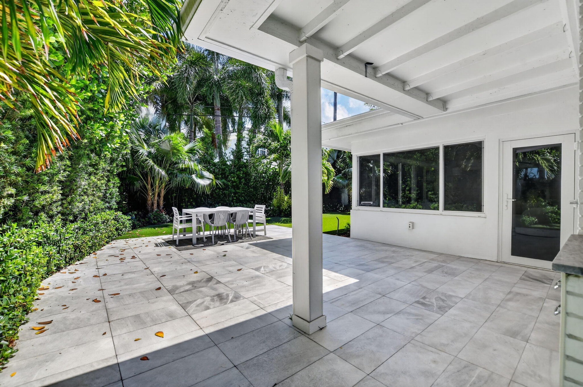 Another view of the covered and open patio area, perfect for entertaining or great space for an outdoor kitchen area!
