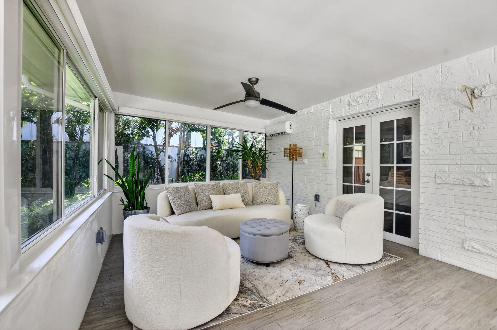 Recently installed windows and screens and high end automatically controlled shades all the way around! The French door glass is treated for privacy, 