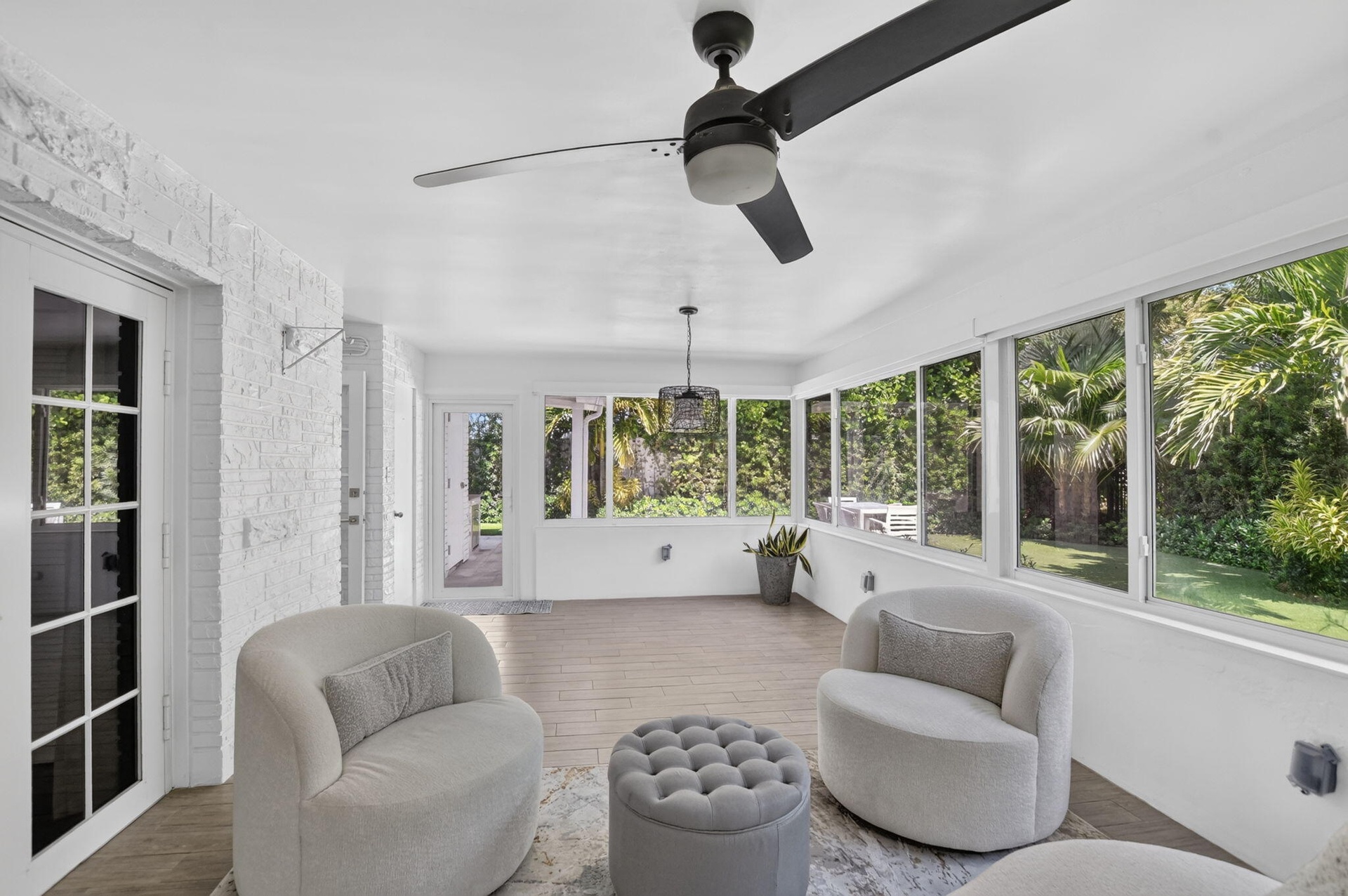 Sunroom has a ceiling fan and light on dimmer, a recently installed A/C split unit for just this (large) room, newly installed custom automatic shades