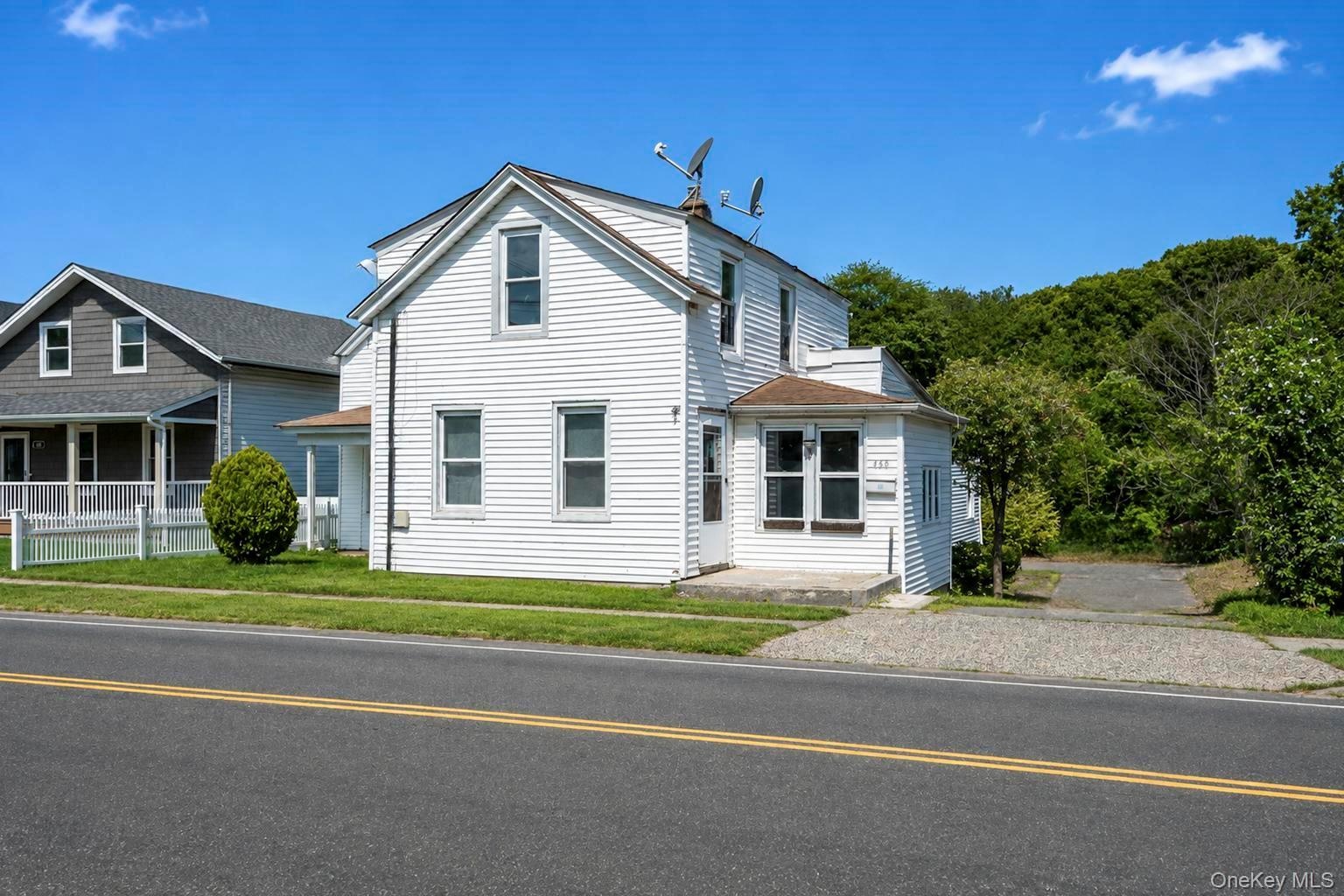 View from the right with the driveway