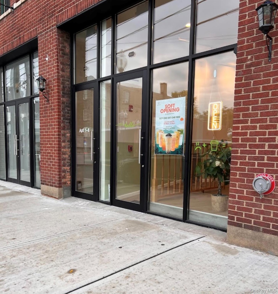 Property entrance with french doors and brick siding