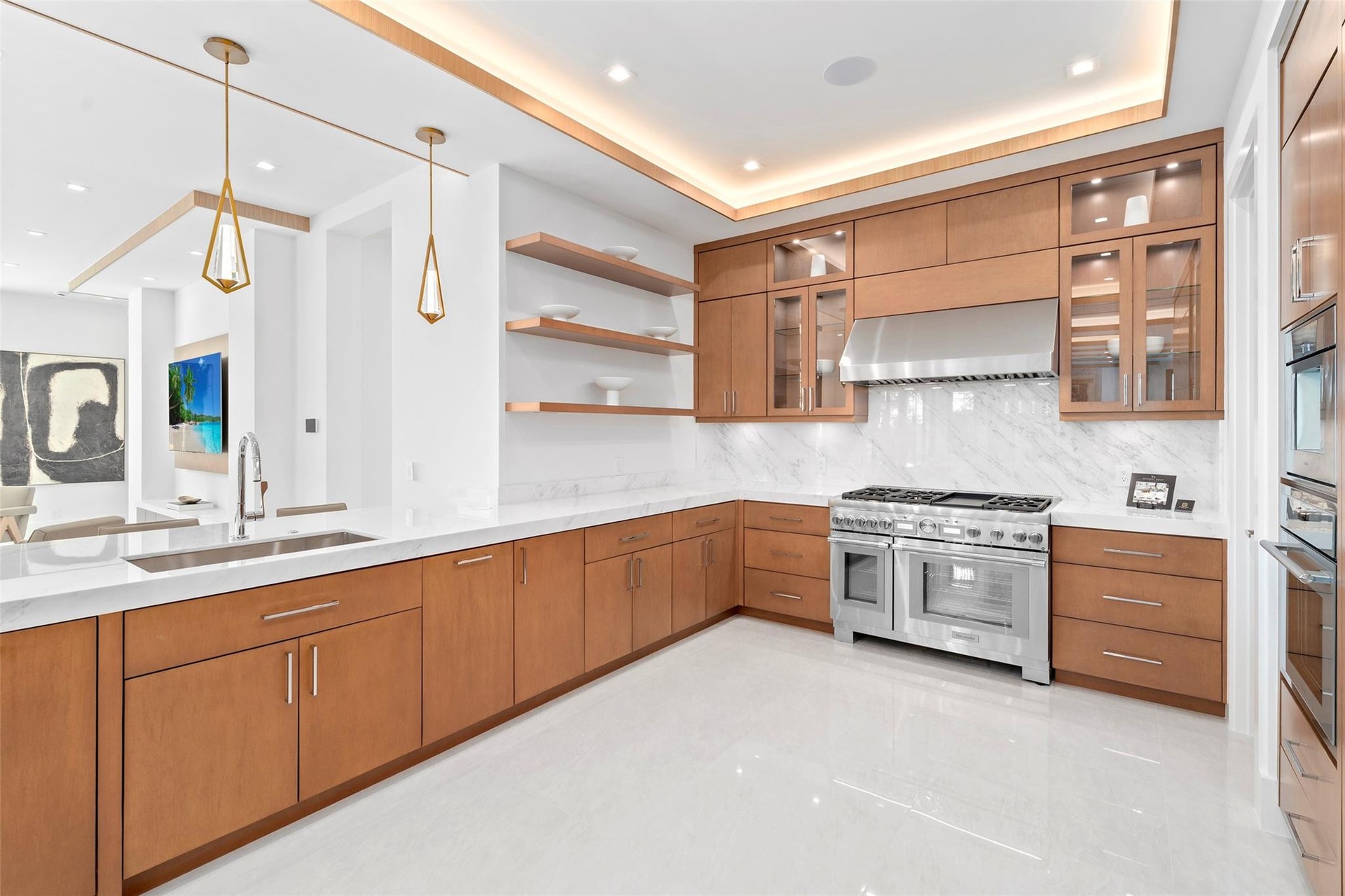spacious and stunning, featuring marble countertops, real wood cabinetry, and abundant room for cooking and entertaining.