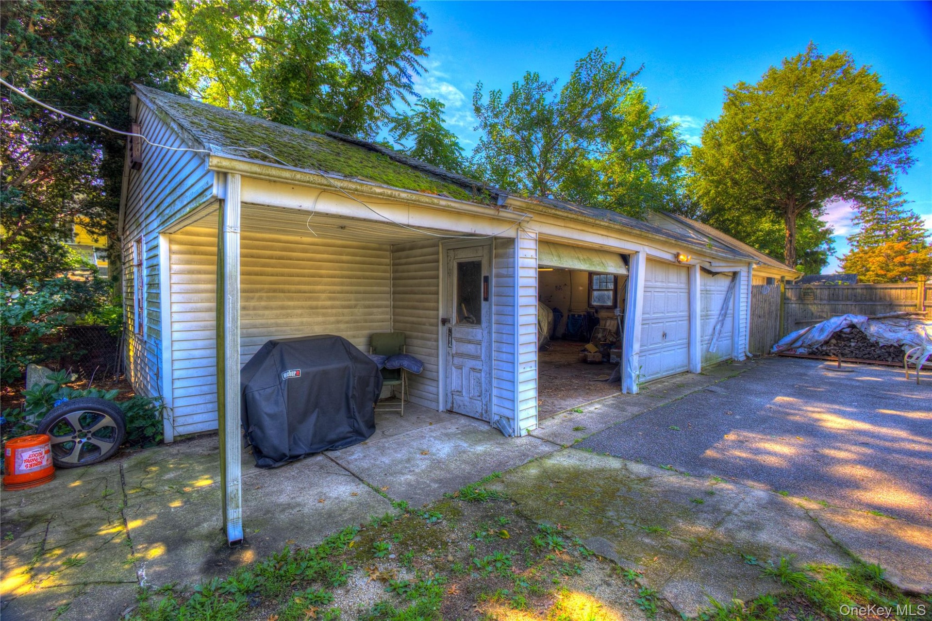 3 Car Garage with attached patio area and worskshop.