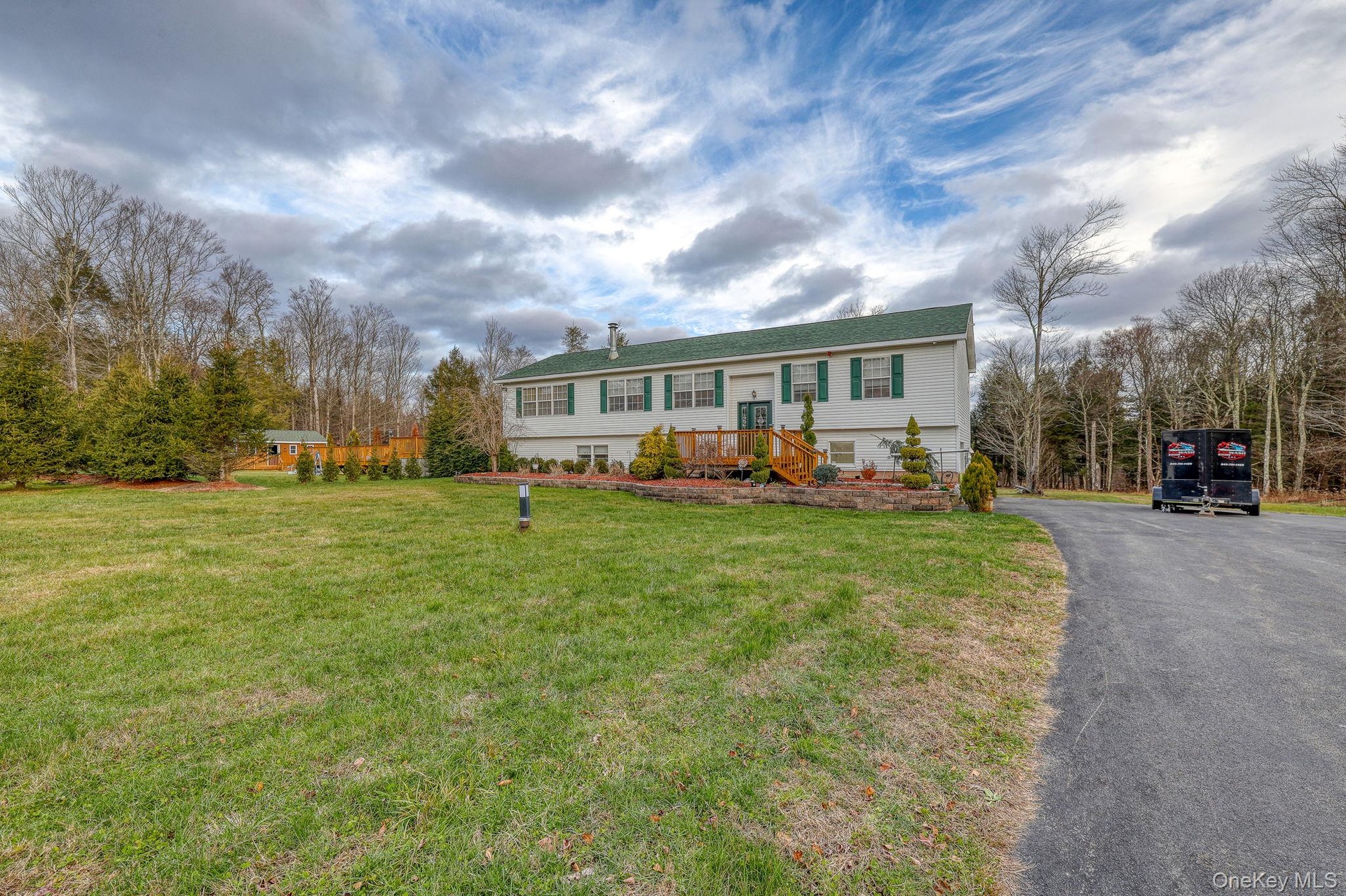 Front of house, blacktop drive and cabana