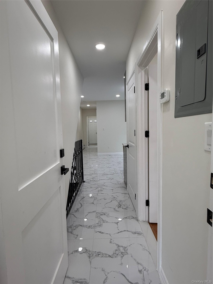 White tile flooring with grey veining