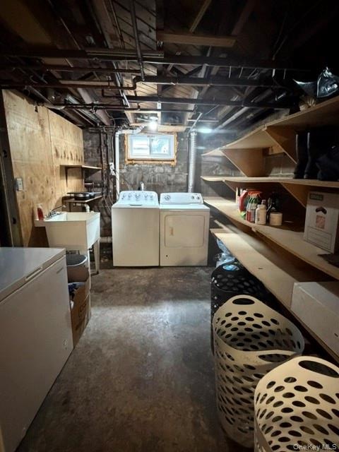 Utility area featuring a laundry sink, window, and exposed ceiling joists.Apt. #1