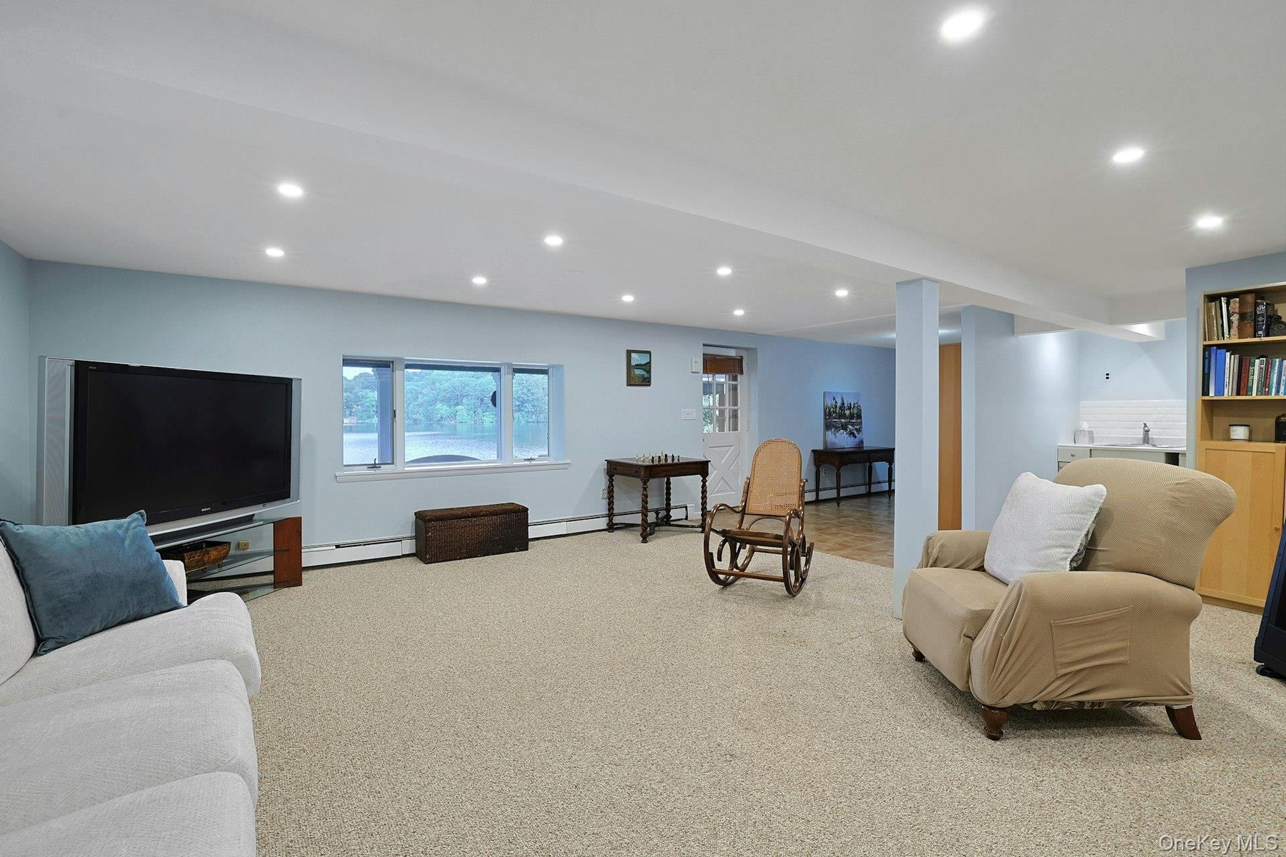 The family room leads directly to the patio, backyard and the lake.