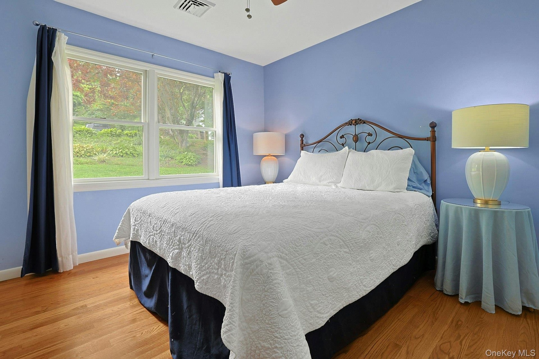 Bright and welcoming, the third  bedroom provides a comfortable retreat for family and guests