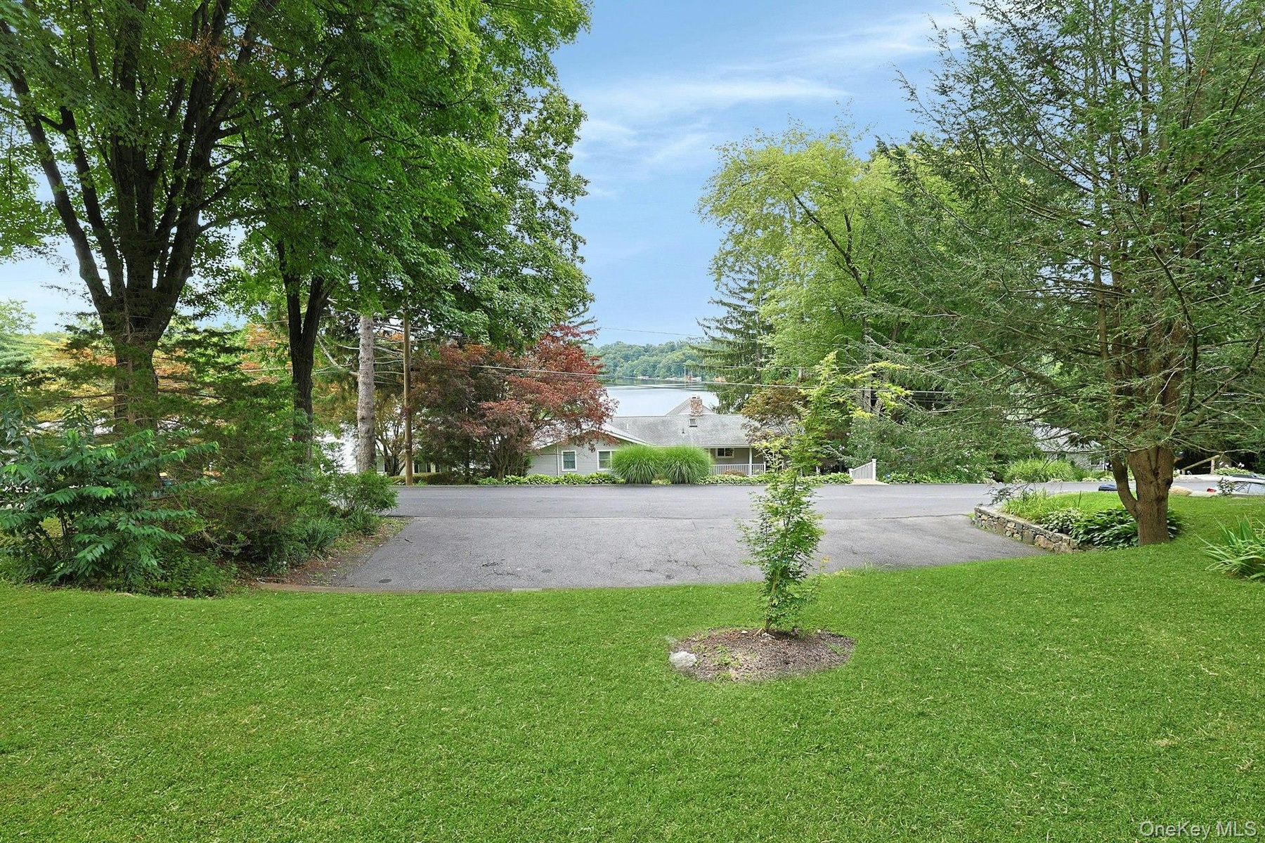 Generous parking for 6–10 vehicles, with additional buildable lot for a garage if desired