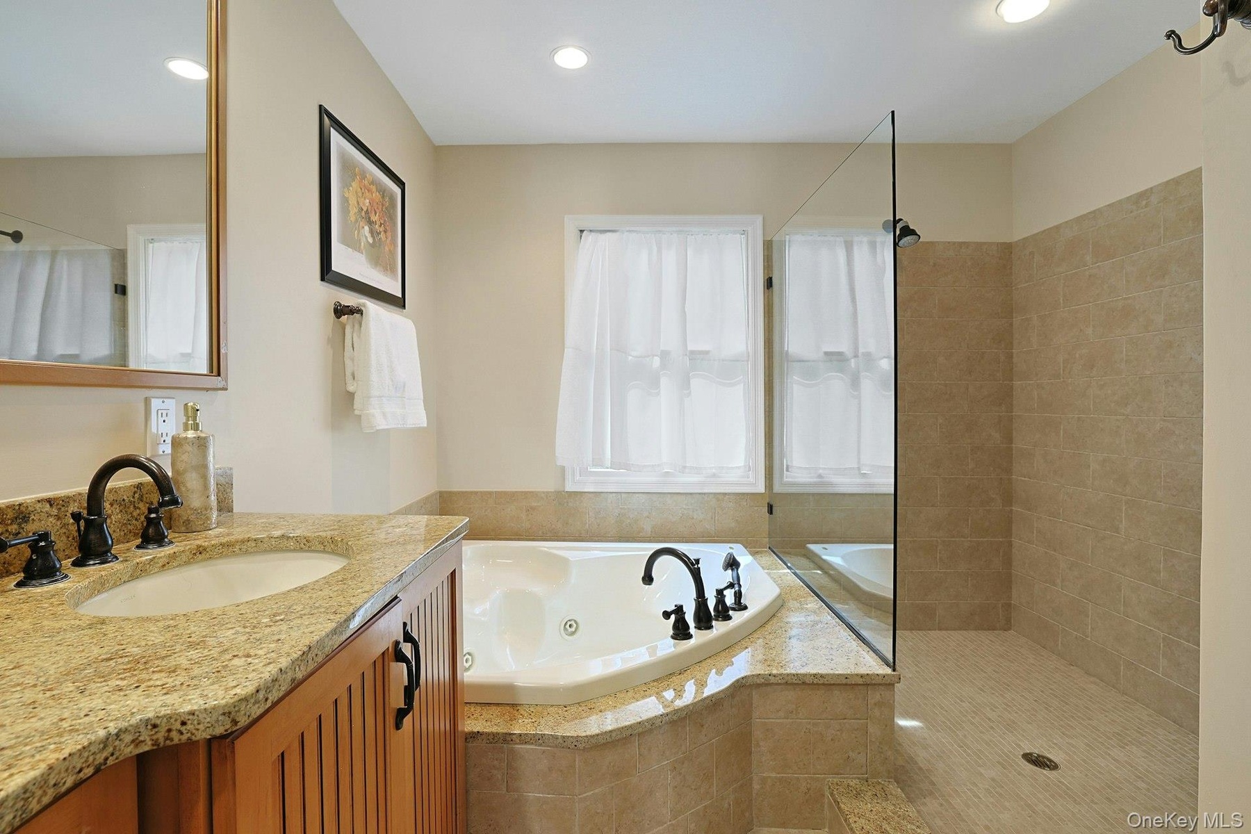 The expansive primary bathroom also has an oversized walk-in shower