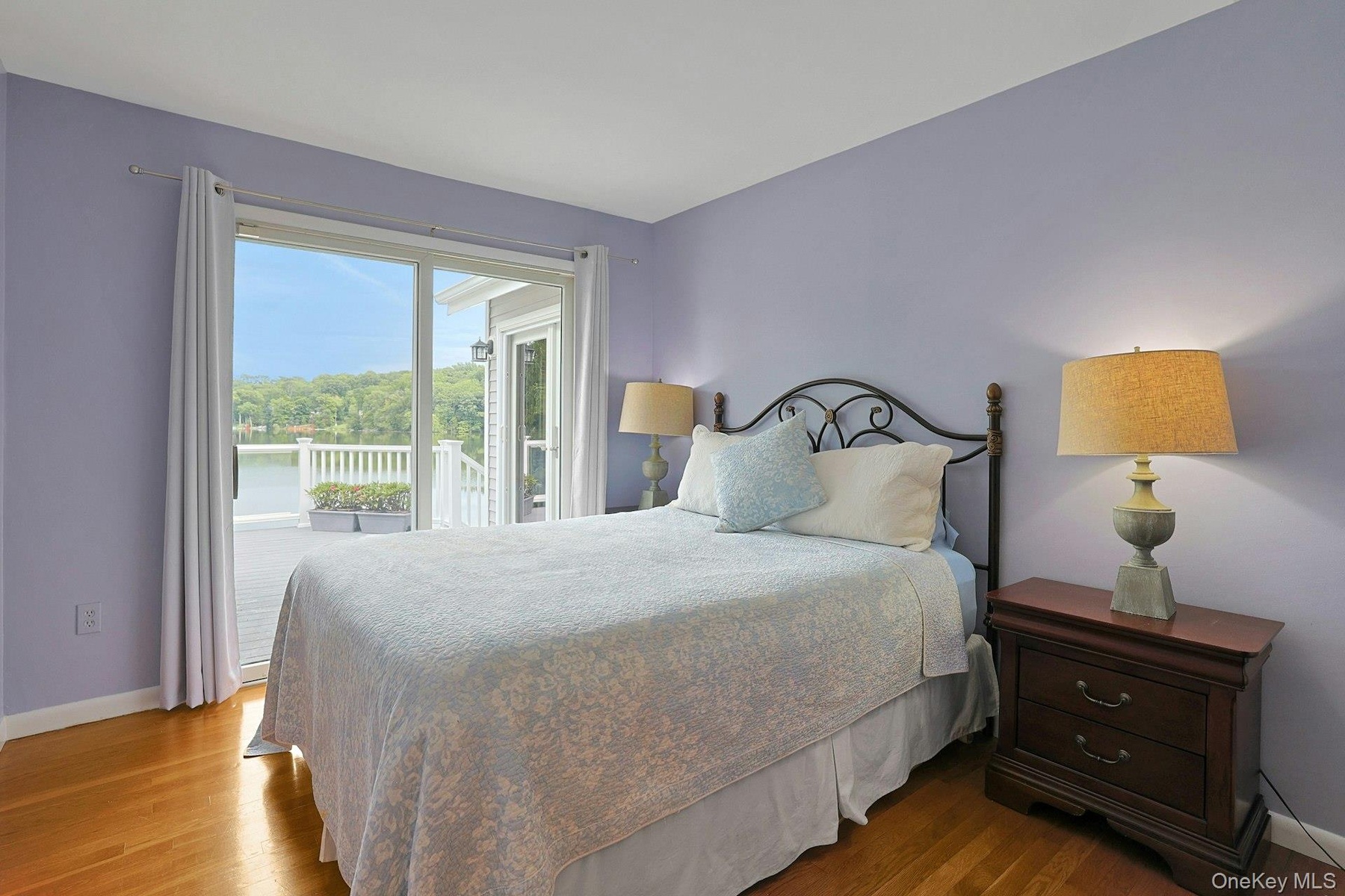 The second  bedroom opens directly onto the deck, where beautiful lake views create a peaceful retreat just steps from your room.