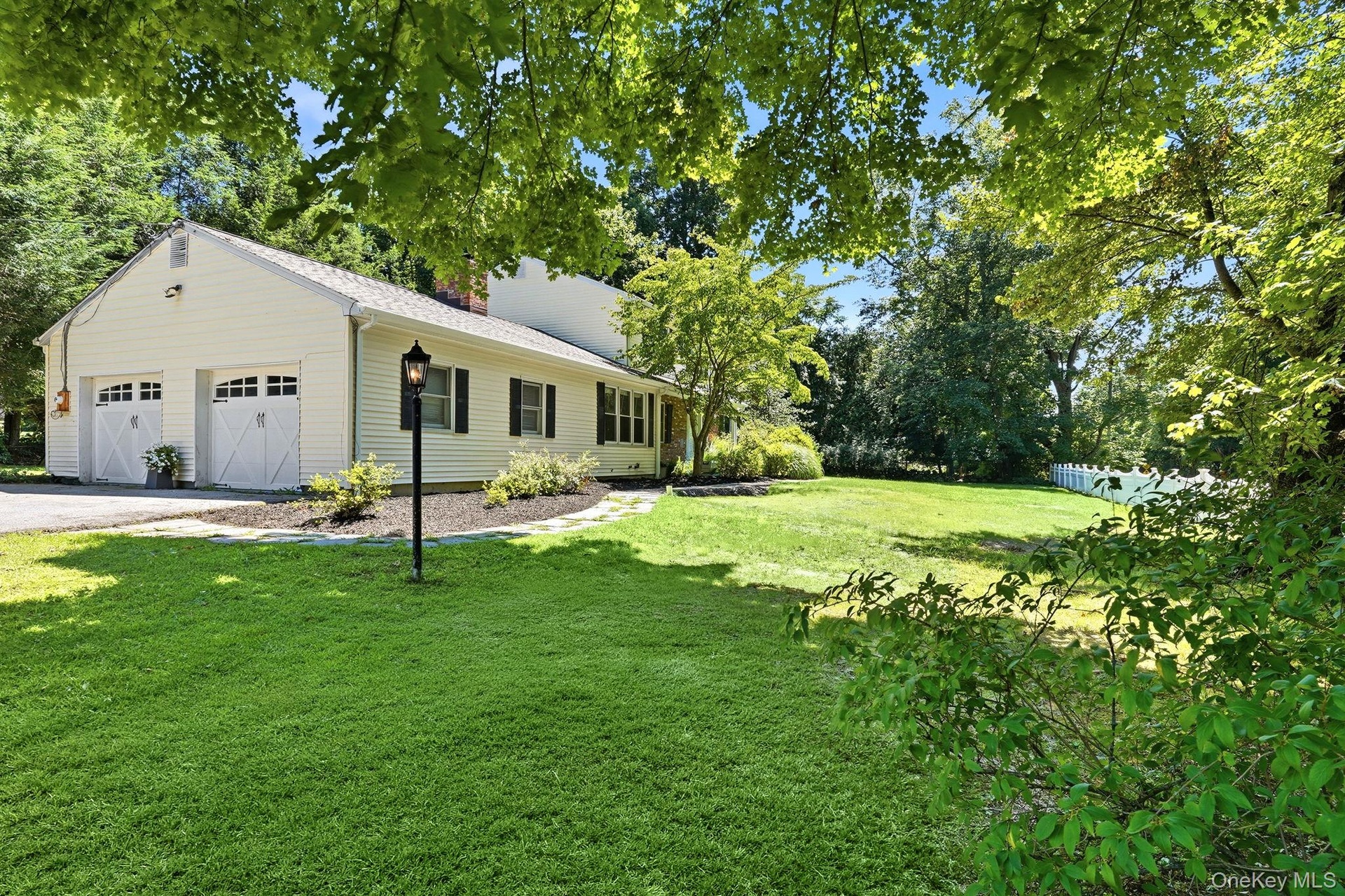 Front yard showing 2 car garage